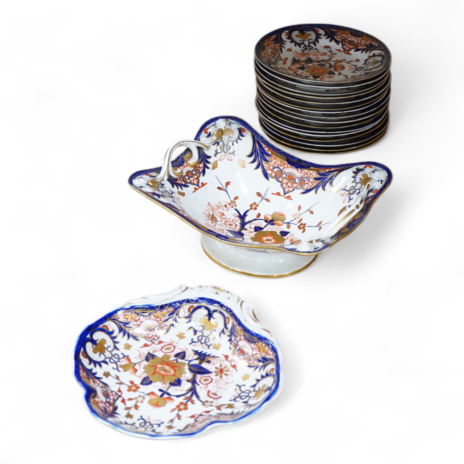 An early 19th century Derby Imari porcelain dessert service, two handled fruit dish 29cm wide
